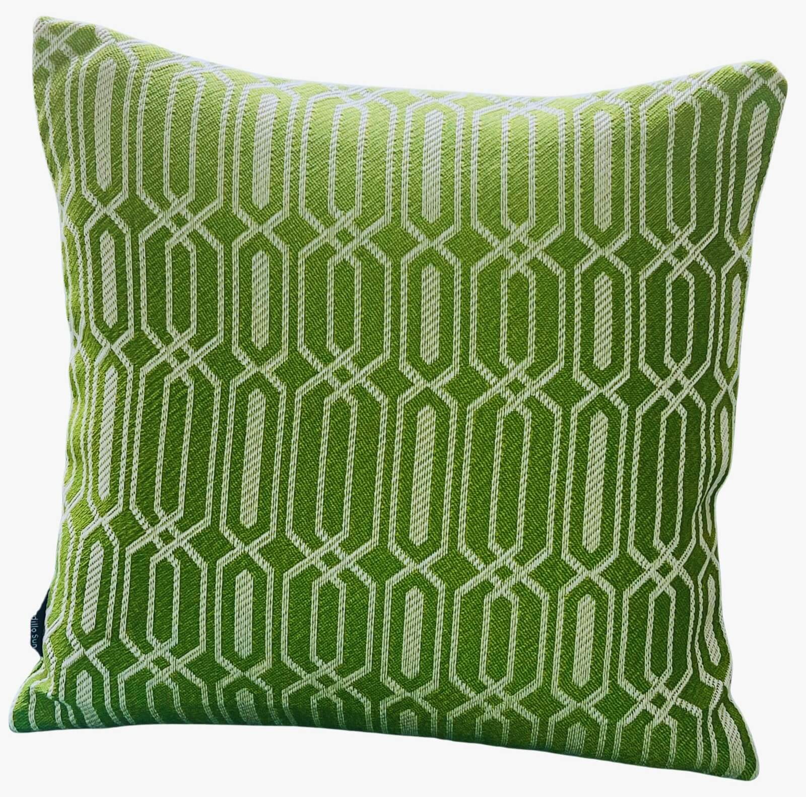 Green outdoor cushion with a white geometric repeating pattern.