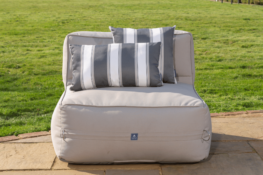 Outdoor Garden Cushion in grey and white striped on a garden sofa